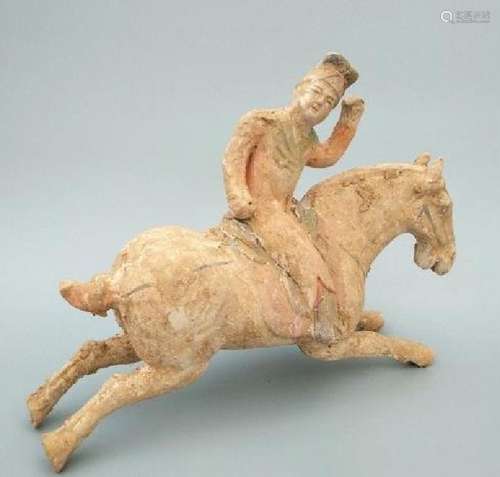 A PORCELAIN HORSE RIDER STATUE HAN DYNASTY 1ST/C.