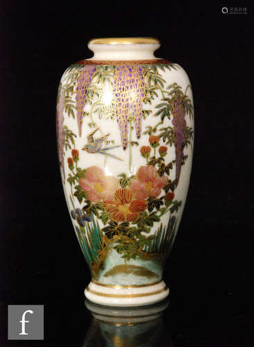 A 20th Century Japanese satsuma ware vase of baluster form decorated with flowers and foliage and