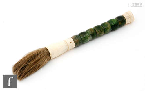 A Chinese calligraphy brush, the carved green hardstone applied with carved bone mounts and hair