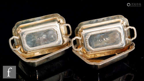 A pair of hallmarked silver novelty miniature rectangular twin handled entree dishes each with