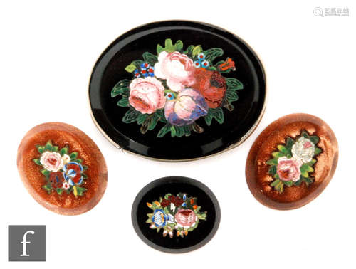 Four 19th Century micro mosaic oval panels two with floral bouquets to a black ground, largest 4.