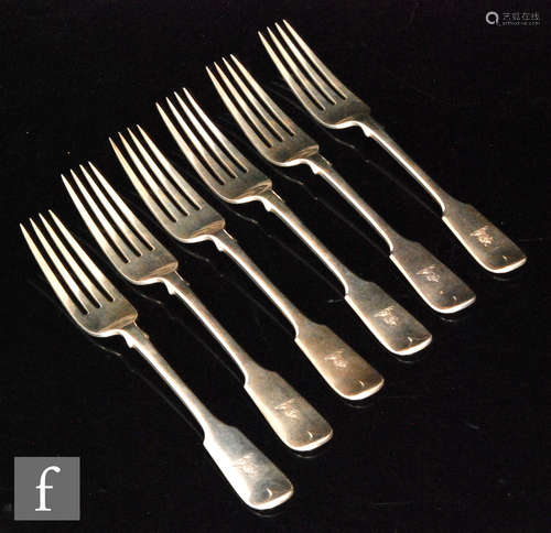 A set of six Victorian hallmarked silver fiddle pattern dinner forks, engraved crest to terminals,