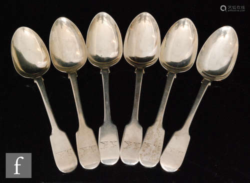 A set of six Victorian Irish silver fiddle pattern dessert spoons with engraved crests to terminals,