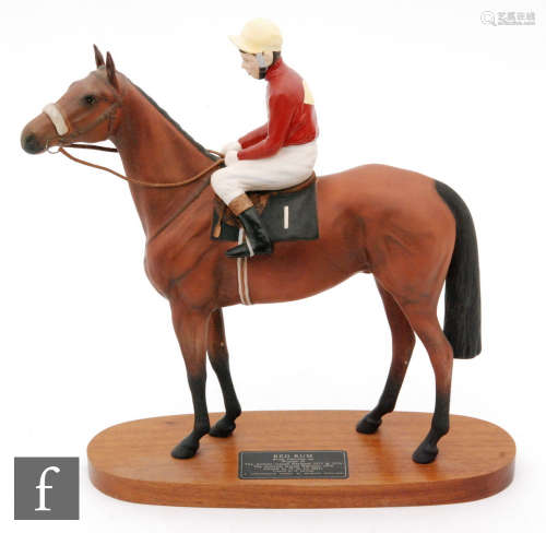 A Beswick Connoisseur model of Red Rum with Brian Fletcher up, mounted to an oval wooden plinth,