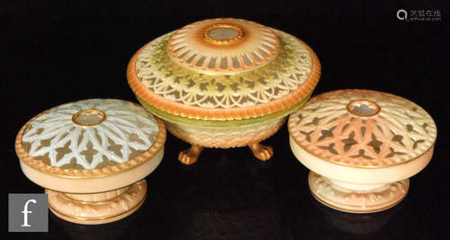 A Royal Worcester pot pourri raised to three paw feet with reticulated cover, the blush ivory ground