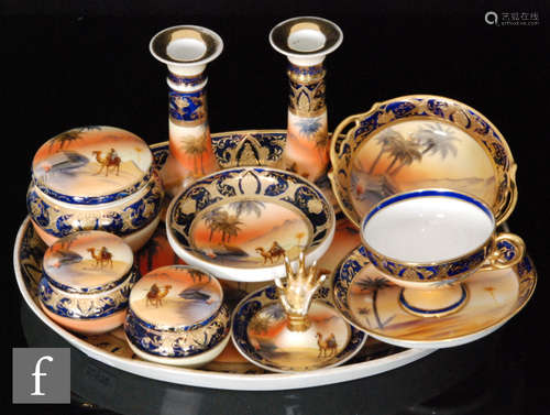 A 1930s Noritake dressing table set comprising tray, hat pin holder, candlesticks, two lidded