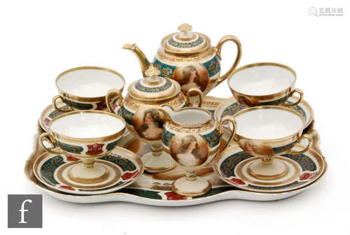 An early 20th Century Austrian cabaret in the Berlin taste comprising four teacups and saucers,