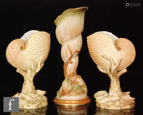 A near pair of Royal Worcester blush ivory shape 101 vases modelled as a nautilus on a