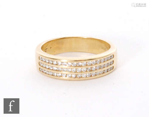 An 18ct diamond ring comprising three rows of eighteen channel set brilliants cut diamonds to