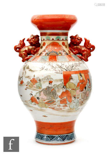 A late 19th Century Kutani vase decorated with figures in a landscape setting below twin dog of Fo