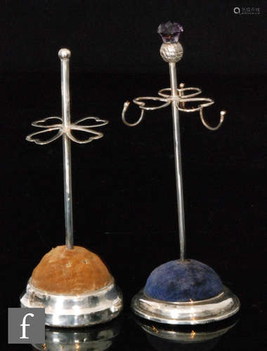 Two hallmarked silver circular hat pin stands each with plain stepped base encompassing the