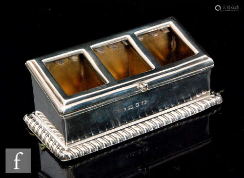 A hallmarked silver rectangular three section stamp box of plain from and gadroon border, length