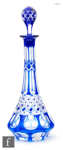 An early 20th Century crystal glass spirit decanter of low shouldered form with slender tapered neck