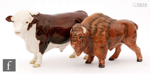 A Beswick Pottery figure of a Polled Hereford Bull, together with a Bison. (2)