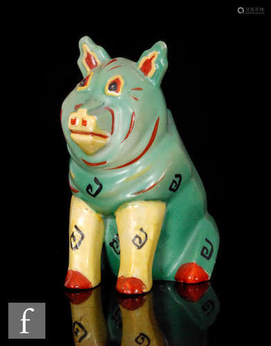 An early 20th Century Louis Wain Lucky Pig figure modelled as a seated pig, painted in green,