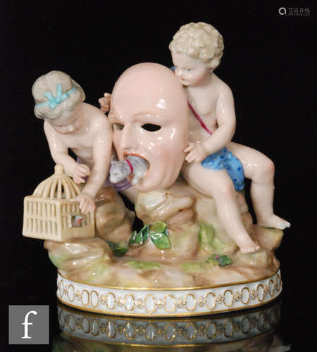 A late 19th Century Meissen figure group, modelled as two putti, seated on a rocky outcrop and