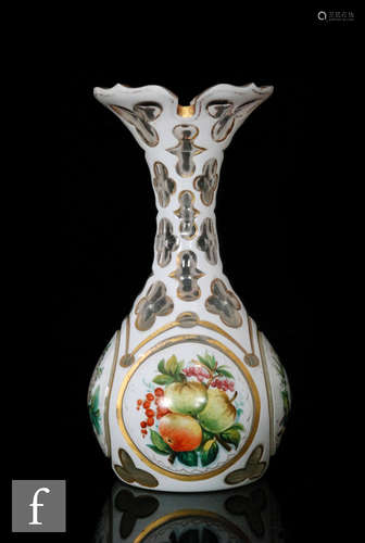 A late 19th to early 20th Century Bohemian glass vase of bottle form with wide rim cased in opal