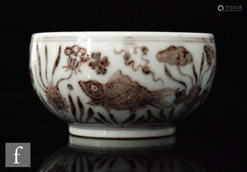 A Chinese iron-red bowl, Xuande (1426-1435) six-character mark, the squat form bowl, with central