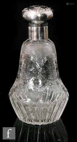 An early 20th Century Stourbridge clear crystal scent or cologne bottle of low shouldered form