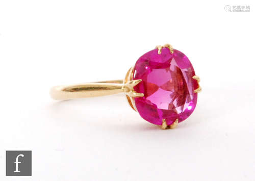 An early 20th Century 18ct single stone synthetic ruby ring, cushioned rectangular claw set stone to