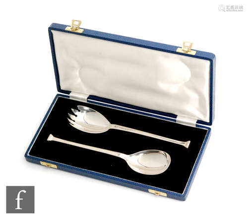 A cased pair of hallmarked silver salad servers with stylised Greek key detail to handles, Sheffield