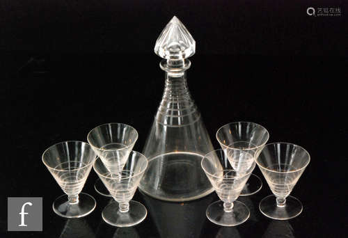 A 1930s Art Deco cocktail set comprising decanter of conical form engraved with concentric rings