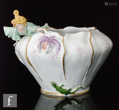 An early 20th Century Plaue Von Schierholz Art Nouveau jardiniere modelled with a young lady looking