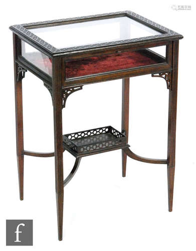 An early 20th Century bijoiterie table or vitrine of rectangular form, the hinged top with a blind