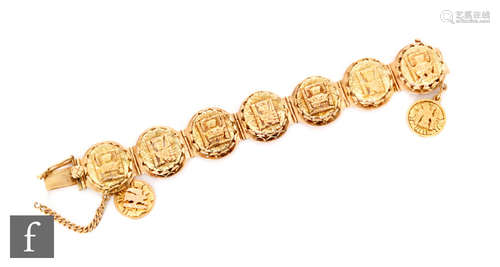 A mid 20th Century 18ct Peruvian two coloured gold seven panel bracelet, oval panels each with a