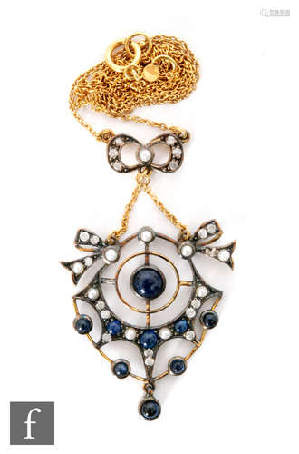 An Edwardian style silver gilt sapphire, seed pearl and diamond open work pendant, length 5cm,