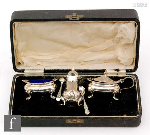 A cased hallmarked silver cased three piece cruet set with gadroon borders and each raised on four