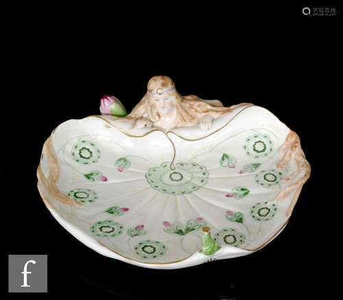 An early 20th Century Plaue Von Schirholz Art Nouveau porcelain table centre, modelled as the