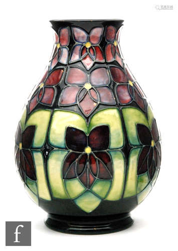 A Moorcroft Pottery vase of baluster form decorated in the Violet pattern designed by Sally