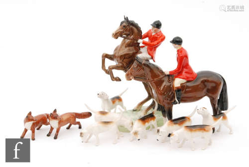 A Beswick hunting group comprising a model 868 rider on horseback, 868, a model 1501 huntsman,
