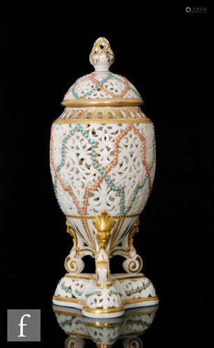 A late 19th Century Grainger and Co, Worcester reticulated vase and cover.