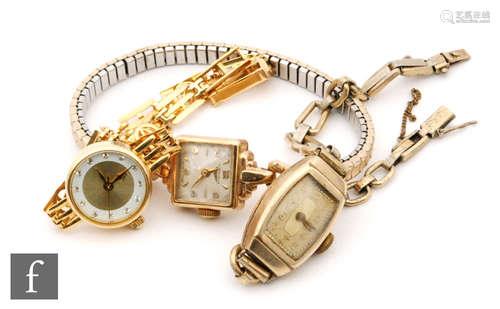 A 9ct lady's Longines wrist watch to a gilt metal strap, with two other similar examples. (3)