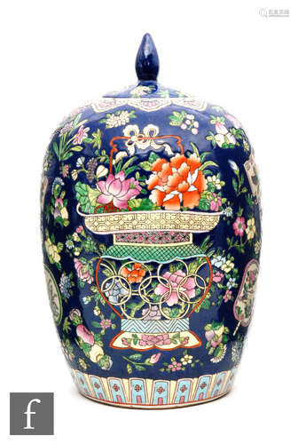 A Chinese famille rose jar and cover, of rounded ovoid form, surmounted by a flat inset cover with