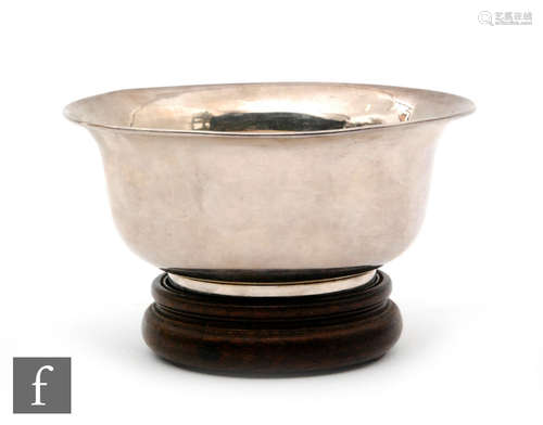 An early 20th Century Chinese silver small circular bowl of plain form, diameter 11.5cm, height 5.