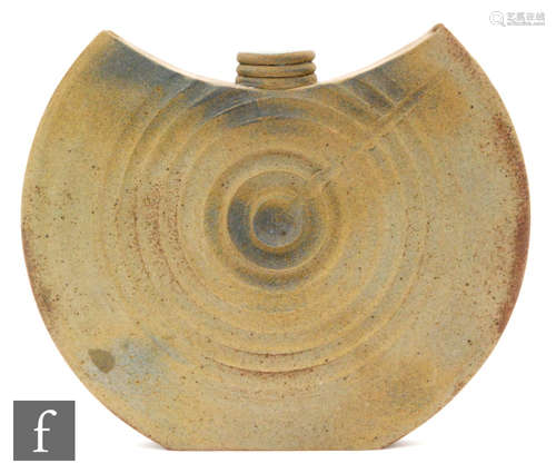 A contemporary studio pottery vase of batwing form with ringed neck with concentric circular