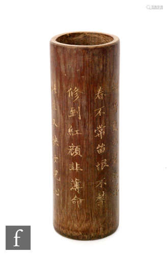 A Chinese bamboo bitong brush pot, of cylindrical form, inscribed with six lines of prose, with