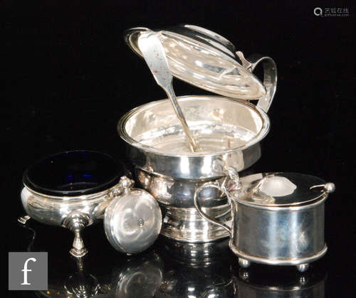 A Georgian hallmarked silver stepped circular pedestal mustard, with a smaller example, an open salt