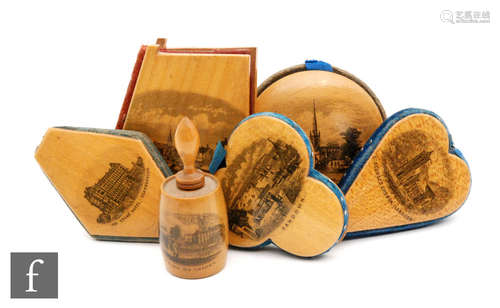 Six Mauchline Ware pin cushions and a tape measure holder each with a different scene to include