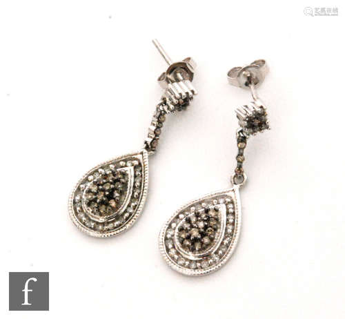 A pair of 9ct white gold diamond drop earrings, pave set cinnamon and white diamonds to a further