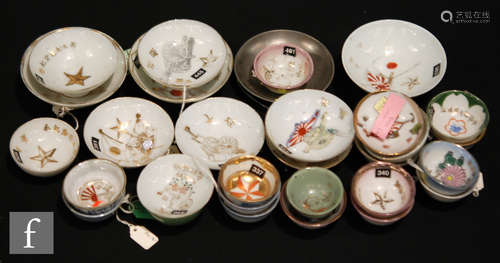 A collection of mid 20th Century Japanese saki cups, to include porcelain and metal examples,