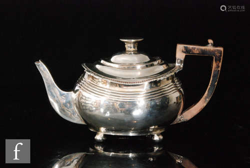 A George III hallmarked silver boat shaped tea pot with part reeded decoration, weight 14.5oz,