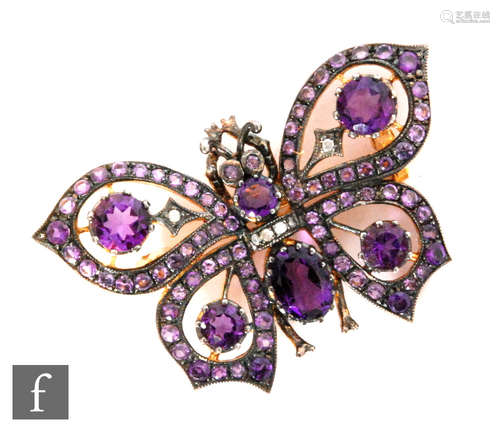 A silver gilt amethyst and diamond set brooch modelled as a butterfly, width 4cm.