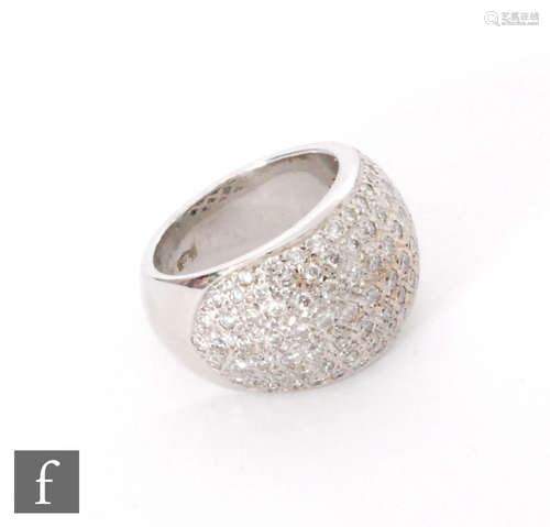 A contemporary 18ct white gold diamond ring, pave set domed head to plain tapering shoulders, weight