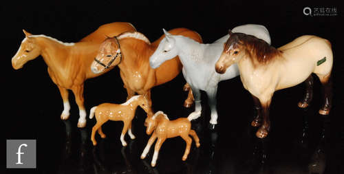 A collection of Beswick animals, mainly horses, to include a dapple grey Huntsman Horse, piebald