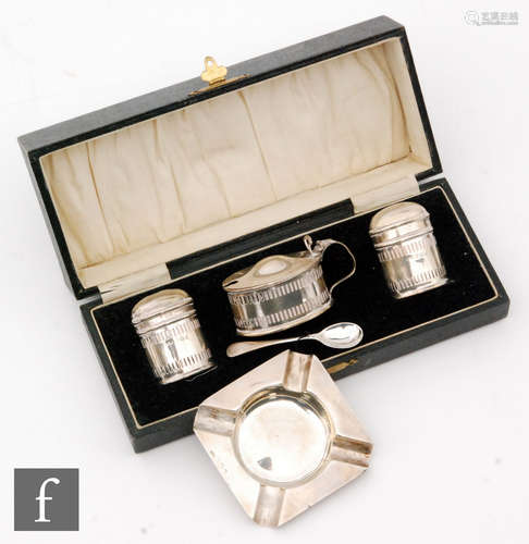 A cased hallmarked silver three piece cruet set of oval form with pierced galleries, with a small