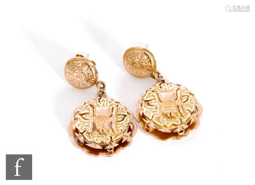 A pair of 18ct Peruvian two coloured gold drop earring each with an Inca figure to a circular